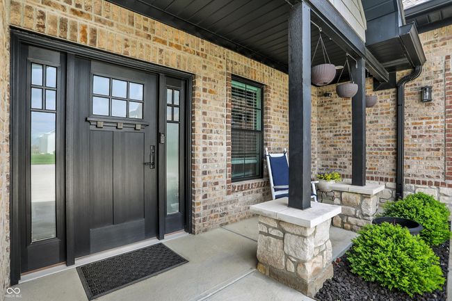 entrance to property with covered porch and brick siding | Image 5