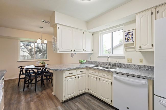 Kitchen with a nice window above the sink. | Image 13