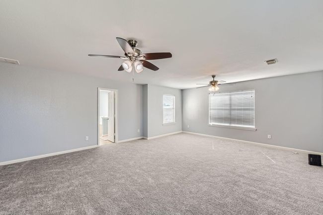 Expansive primary bedroom on the second floor ensures comfort and luxury. | Image 15