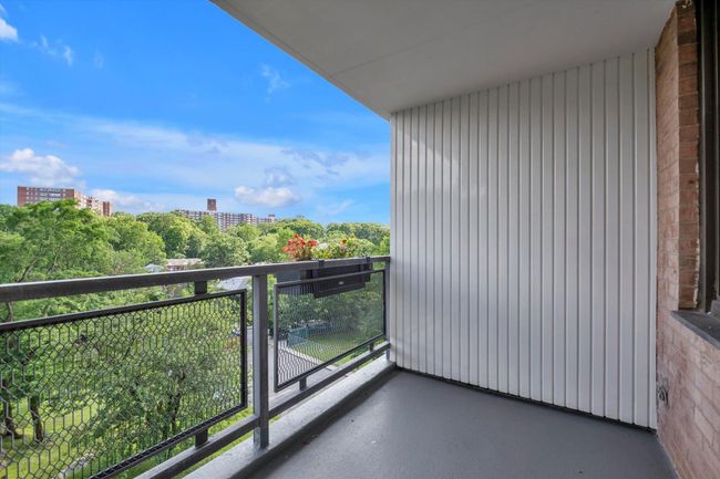 Balcony featuring a view of city | Image 15
