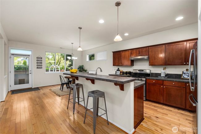 sprawling kitchen/dining area flows seamlessly out to the back patio and into the large living room! | Image 9