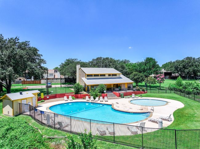 Beautiful community pool and community center is a short walk across the greenbelt behind the home. | Image 24