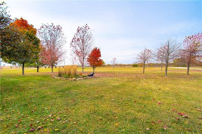 Settle into country life on this ranch property, where 9.55 acres stretch before you and a cozy front porch beckons you to stay a while. | Image 3