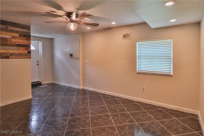 Tiled empty room featuring ceiling fan, recessed lighting, and baseboards | Image 12