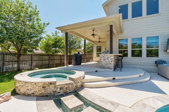 Spa with waterfall and stream to pool | Image 39