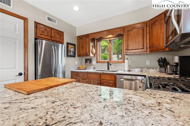 Beautiful granite countertops in kitchen as well as baths | Image 12