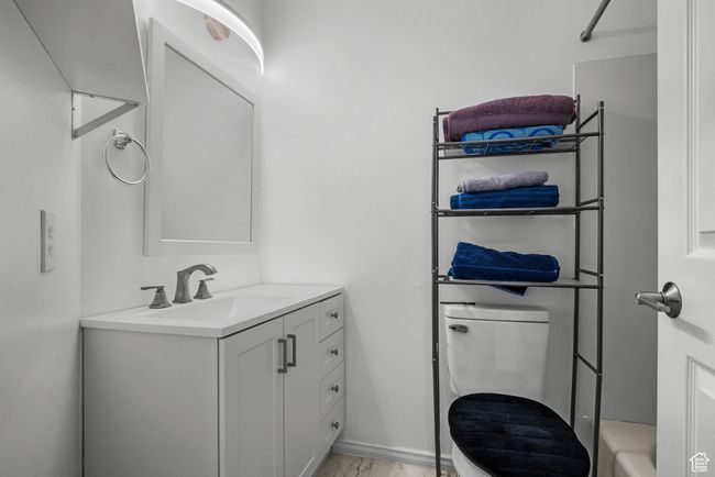 Bathroom with vanity and a tub to relax in | Image 19
