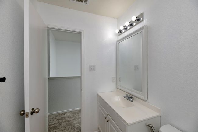 Bed room featuring baseboards, new carpet, and ceiling fan | Image 26