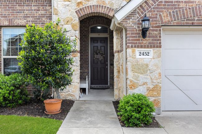 Entrance to property with brick siding and stone siding | Image 4