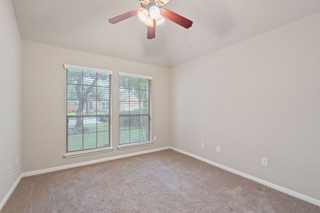 Bedroom 3 with carpet floors, ceiling fan | Image 17