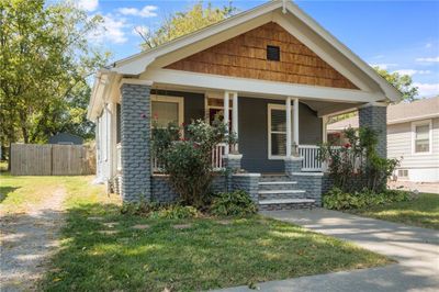 View of front facade featuring a front yard and covered porch | Image 2