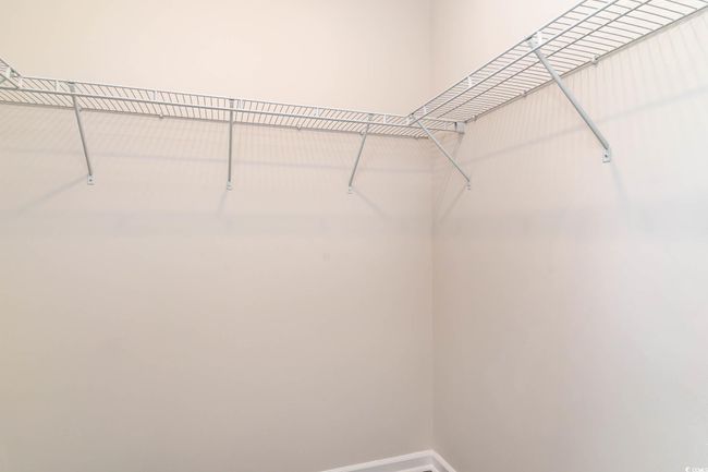 View of spacious closet | Image 15