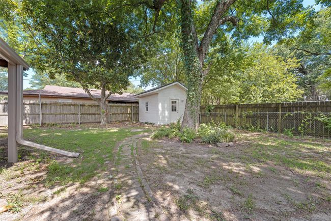 Fenced backyard featuring an outdoor structure | Image 28