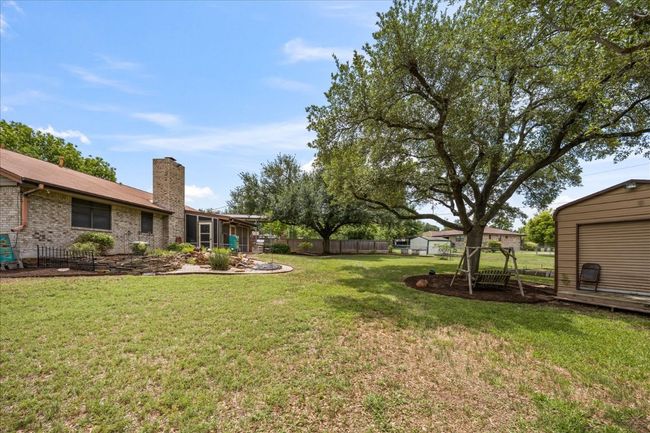 View of yard featuring a storage unit | Image 33