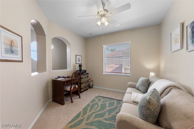 Office with ceiling fan, light carpet, and baseboards | Image 25