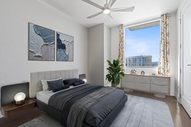 Bedroom with wood finished floors and ceiling fan | Image 9