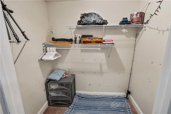 Spacious closet with carpet floors | Image 42
