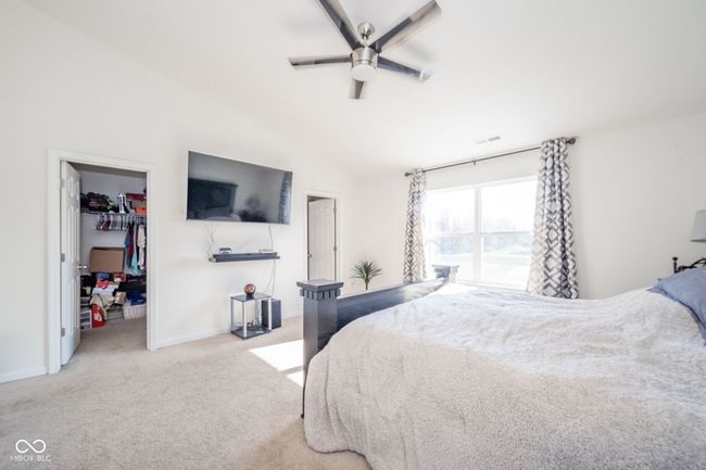 primary bedroom with view of 2 walk in closets | Image 33