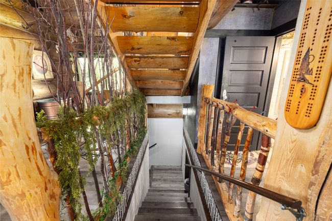Stairs featuring wood finished floors | Image 7