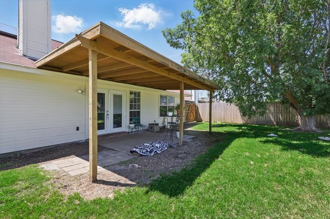 View of yard featuring french doors, a patio, and fence | Image 27