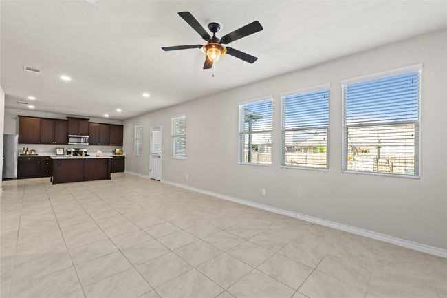 Open floor plan living and dining area with lots of windows, providing ample natural light | Image 5