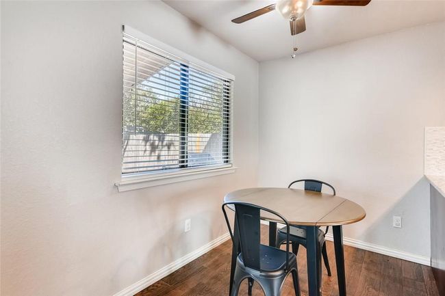Dining room featuring ceiling fan, baseboards, and wood finished floors | Image 21