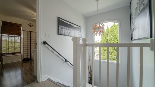 Stairway has natural light from large wi | Image 17