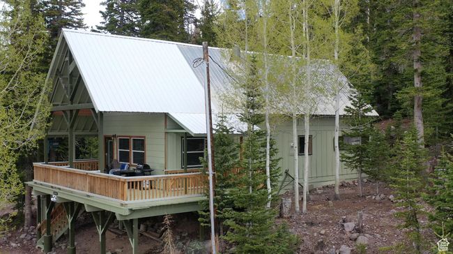 Back of property with a deck and a metal roof | Image 69