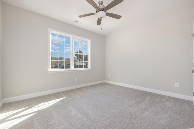 Carpeted spare room featuring ceiling fan | Image 21