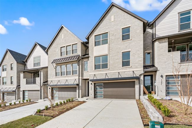 Beautiful brick exterior paired with inviting architectural elements create outstanding curb appeal for this dream home! | Image 4