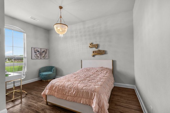 Bedroom with wood finished floors and baseboards | Image 27