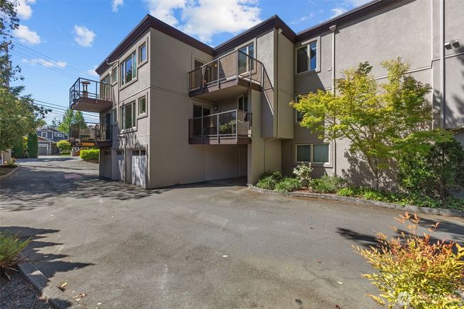 203 Balcony pictured (center top of picture). You can see it is recessed from the neighboring balcony allowing for added privacy. | Image 32