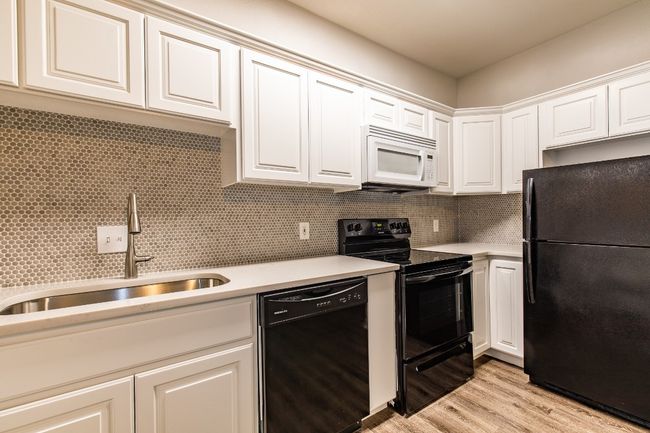 Photo shows remodeled kitchen from 3-bedroom floor plan. | Image 9