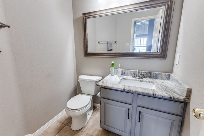 Half bathroom downstairs between living areas. | Image 32