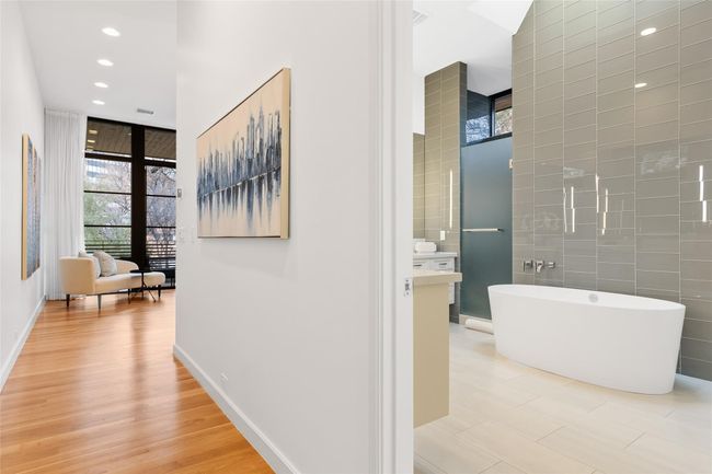 Hallway featuring healthy amount of natural light, recessed lighting, light wood-style flooring, and baseboards | Image 14