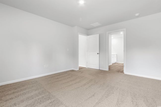 View of carpeted spare room | Image 28