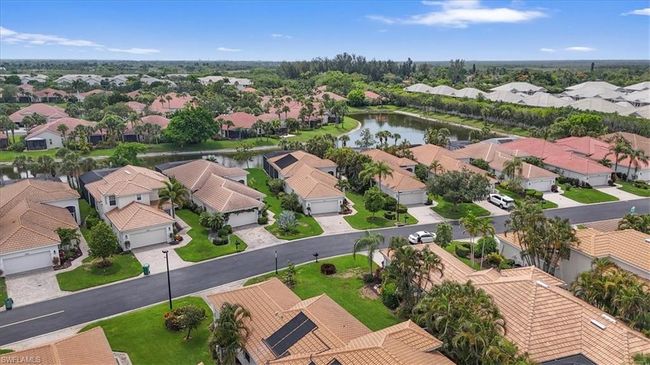 Aerial view of residential area featuring a nearby body of water | Image 39
