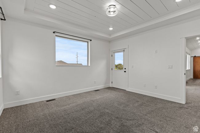 Unfurnished room with a raised ceiling, wooden ceiling, carpet floors, baseboards, and recessed lighting | Image 15
