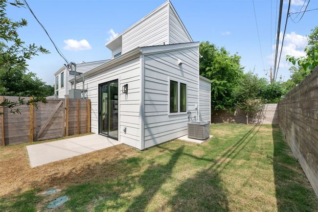 Back of property featuring cooling unit and a gate | Image 27
