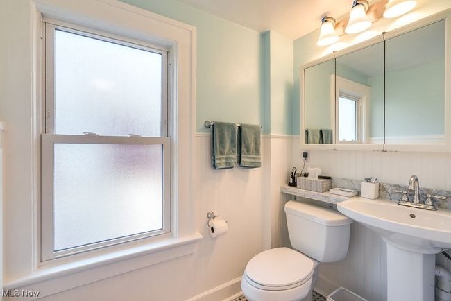 Bath featuring toilet and tile and marble | Image 19