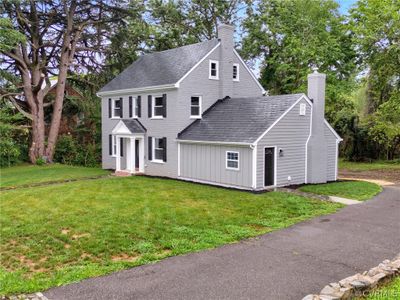 View of property exterior with a yard | Image 2