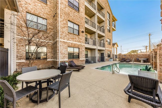 View of swimming pool featuring a patio area | Image 35