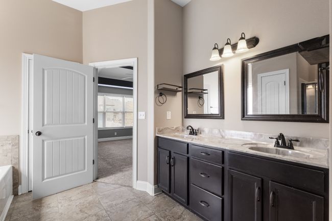 Primary Bathroom Features a Double Vanity with Framed Mirrors! | Image 20