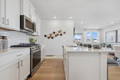 (Photo of decorated model, actual homes colors and finishes will vary) Imagine preparing a wonderful meal for dinner in this kitchen or entertaining friends and family over the weekend! | Image 2