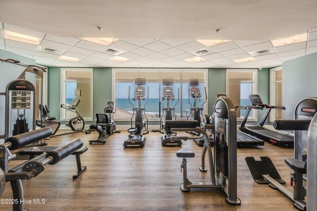 Grande Villas at the Preserve boasts an amenity package that will have you thinking you are on vacation everyday! The amazing poolside setting, with the Atlantic Ocean as a back drop, creates a feeling of glamour. The lounges and oceanside terrace provide beautiful spaces to relax with friends and family or take in the breathtaking sunrises and sunsets. Included with the monthly HOA is a game room, club room, fitness center with an OCEANFRONT view, a pool/beach towel service for owners, planned social activities, a dog park, 2 electric vehicle charging stations, and a fire pit. Water, sewer, cable and internet are also included. Specific only to first floor units, you'll love and appreciate the perk of having exterior steps to the outside from your private, oceanside balcony. You'll be at the pool or on the beach in a snap! Check out the photos and then COME SEE why Grande Villas is a FAVORITE among all. Rental history is available upon request. | Image 30