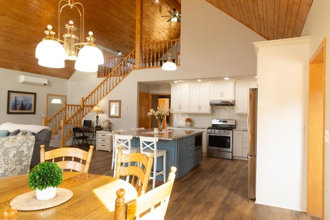 View from dining area. Door beyond stairs is to screened porch. | Image 13