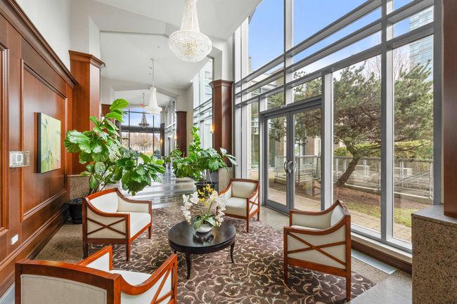 Sunroom / solarium with a chandelier, french doors, and ornate columns | Image 14