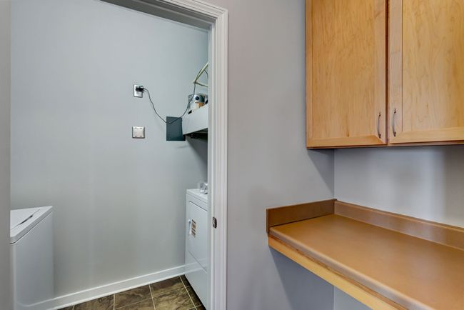 Great built in desk off between kitchen and laundry room. | Image 12