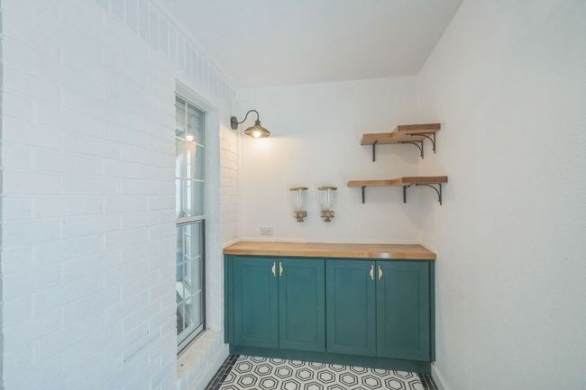 Walk in pantry off dining room with additional shelving | Image 14