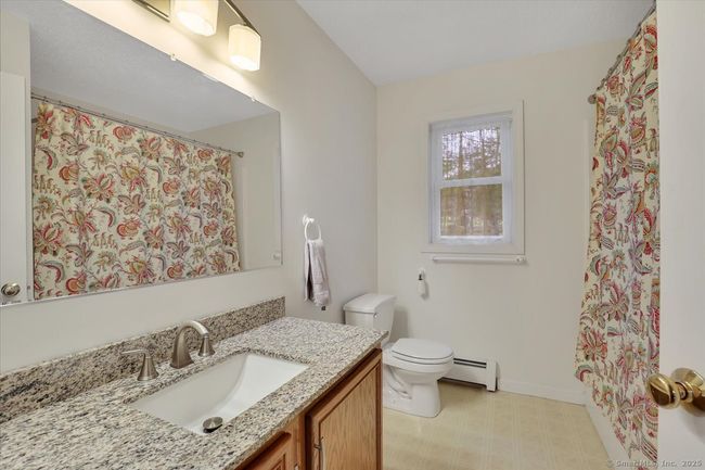 Primary en-suite full bathroom, granite topped vanity. | Image 18